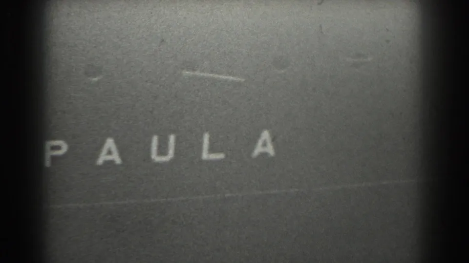 1939 San Francisco 8mm frame showing the cropped name PAULA on a dark vessel surface near the end of the clip.