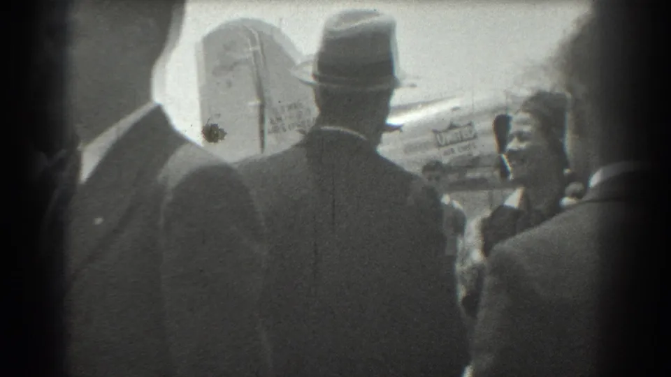 A 1939 San Francisco airport crowd stands near a visible United Airlines tail, with adults in suits and hats facing the aircraft area.