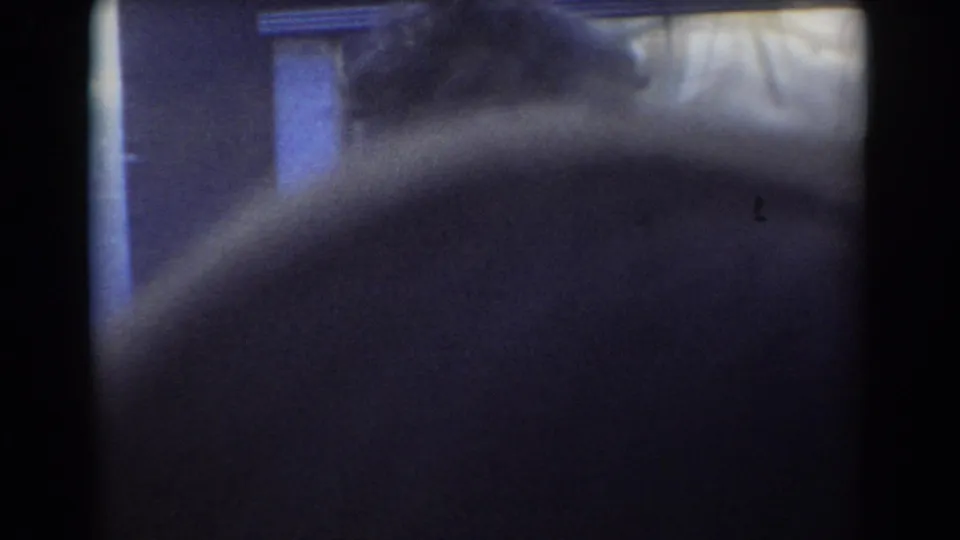 The final frame is mostly blocked by a nearby spectator, with only a dim view of the misty hose operation beyond.