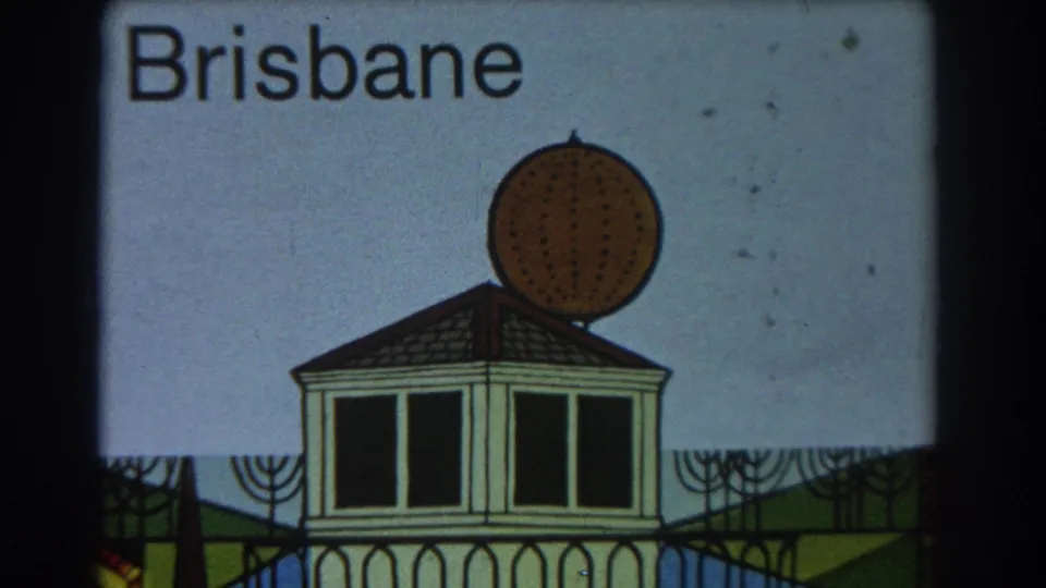1967 Brisbane home-movie title card showing a hand-drawn building with a circular perforated dome against a pale sky.