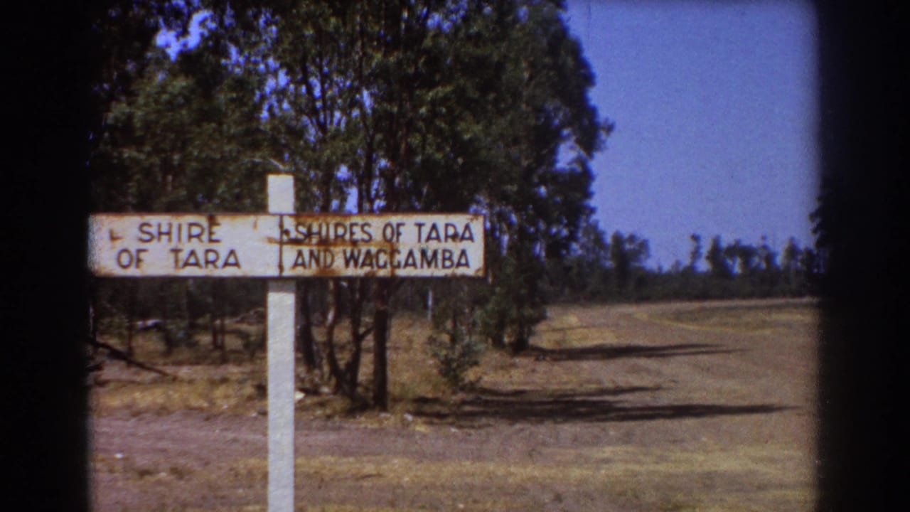 Weathered Shire of Tara and Waggamba sign beside a dry rural road.