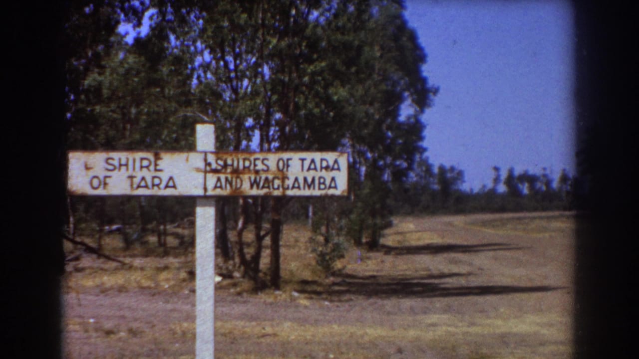 The Shire of Tara and Waggamba sign appears beside a quiet road with trees and dry ground, consistent with the 1967 Australian clip metadata.