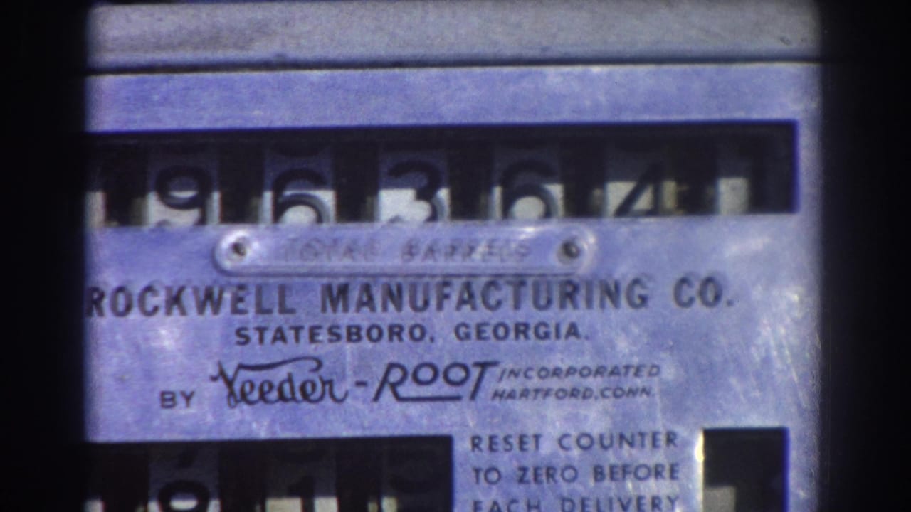 Close view of a metal TOTAL BARRELS counter with Rockwell Manufacturing Co. label.