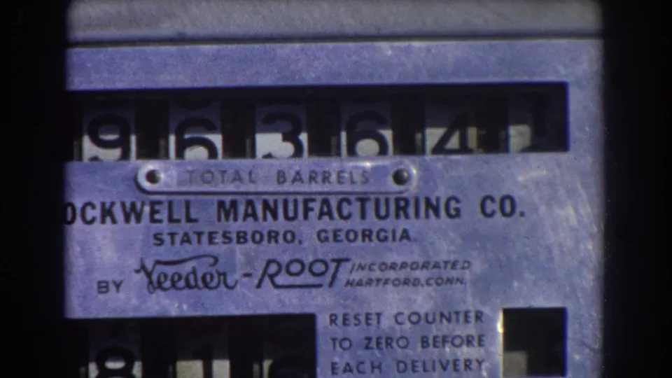 Close 8mm view of the Rockwell Manufacturing Co. barrel counter plate with number wheels visible above the label.