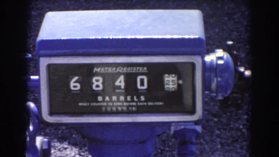 Close-up of the Brisbane oil facility meter register as the mechanical counter advances to 6840 barrels.