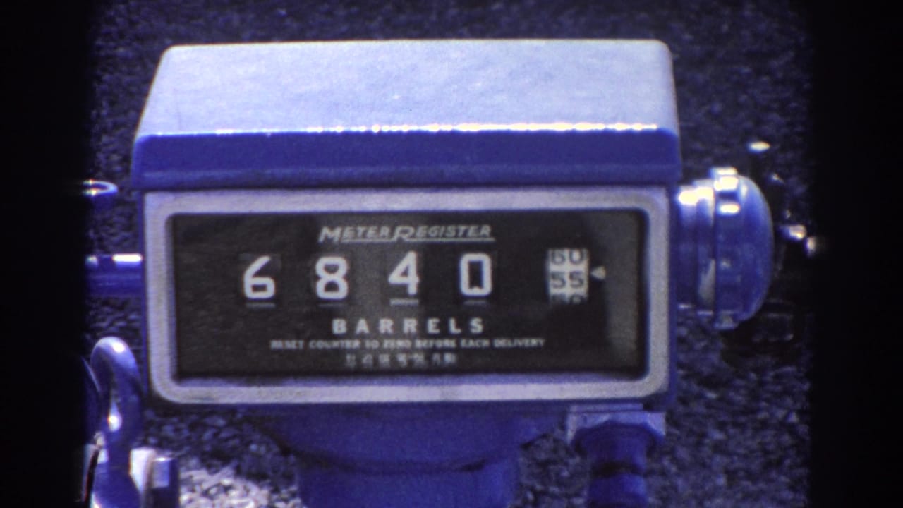 Close view of a blue barrel meter register showing 6840 barrels.