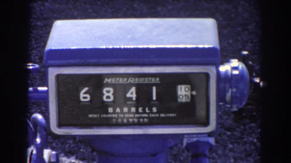 1967 Brisbane 8mm close-up of a blue industrial meter register after the barrel count advances to 6841.