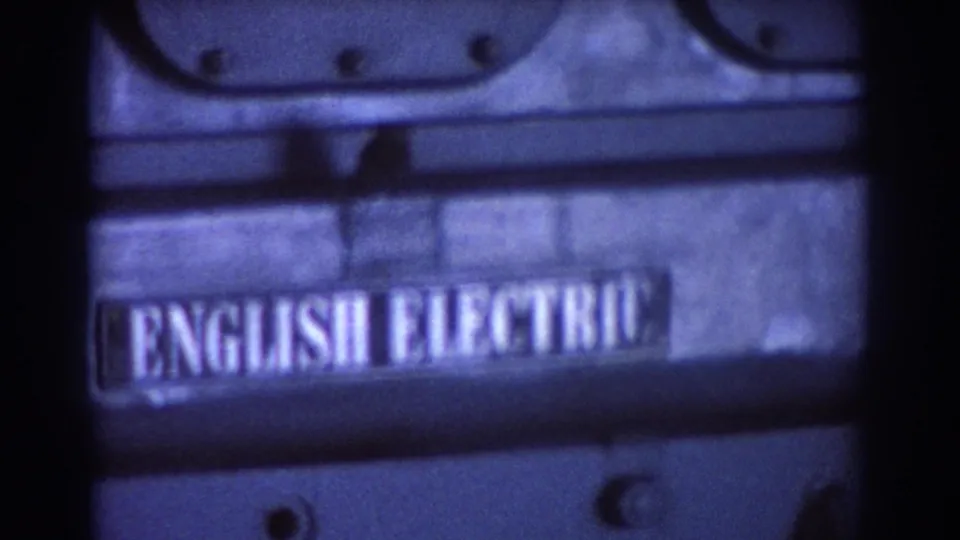 Close 1967 Brisbane frame centered on the English Electric nameplate mounted on the heavy industrial engine.