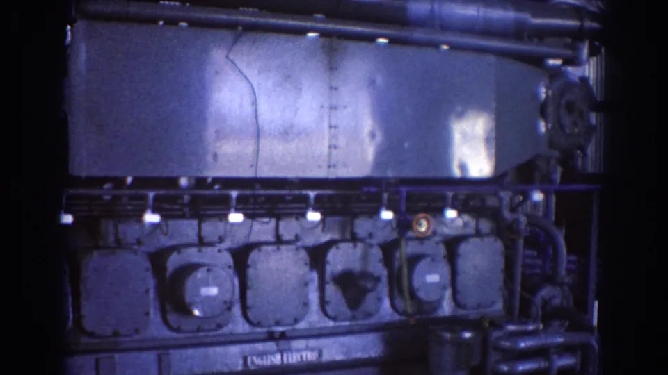 1967 Brisbane close-up of an English Electric industrial machine showing access panels, bolts, casing seams, and dark piping.