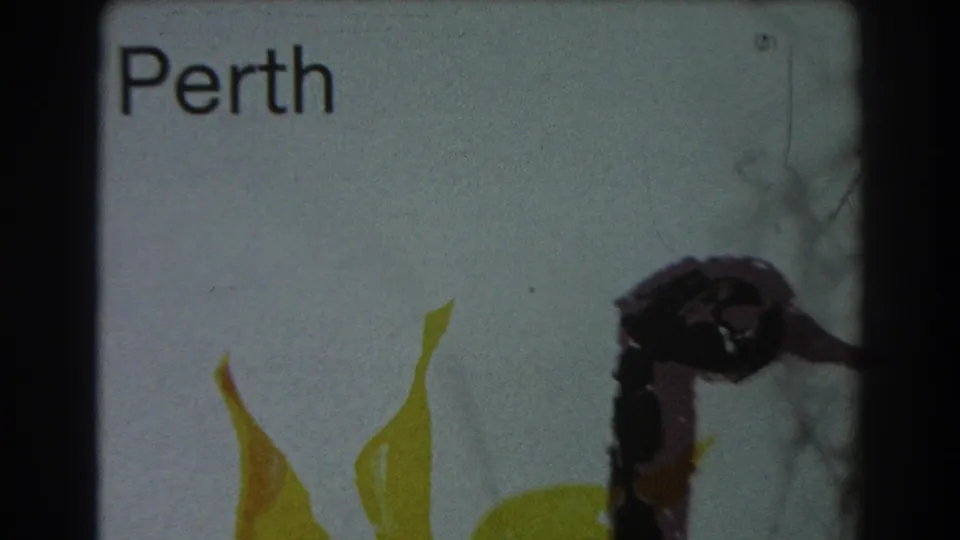 1967 8mm frame of a white Perth sign and yellow swan motif, with scratches, soft focus, and dark borders from the film scan.