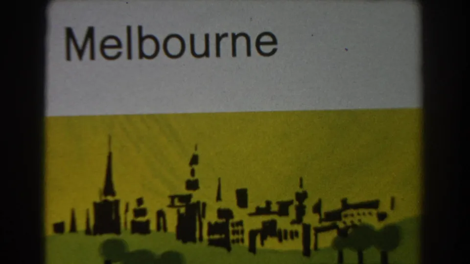 Melbourne title card repeated on 8mm film, showing bold black text and a simplified skyline silhouette.