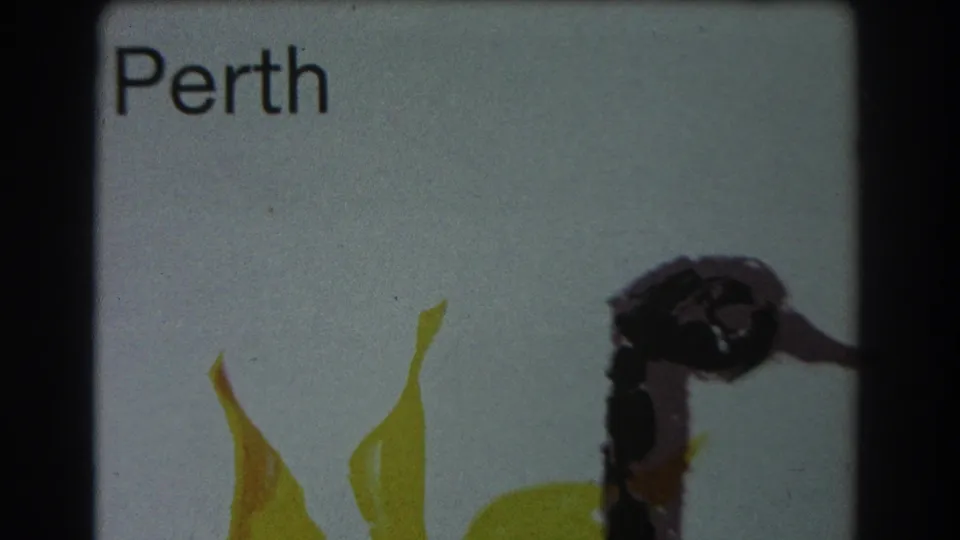 1967 Perth-labeled frame showing yellow painted shapes and a dark form on a pale background with visible 8mm softness.