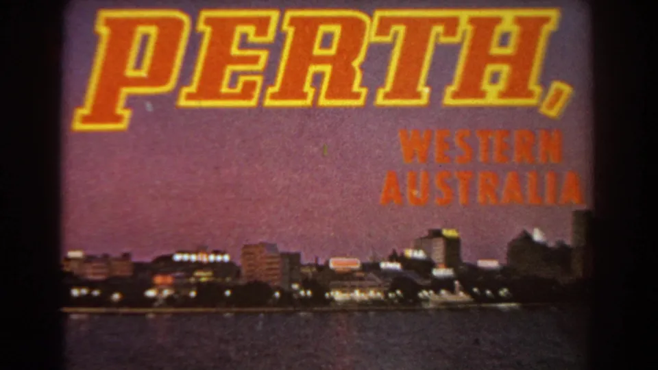1967 Perth, Western Australia title card over a waterfront cityscape, with glowing building lights and water visible below.