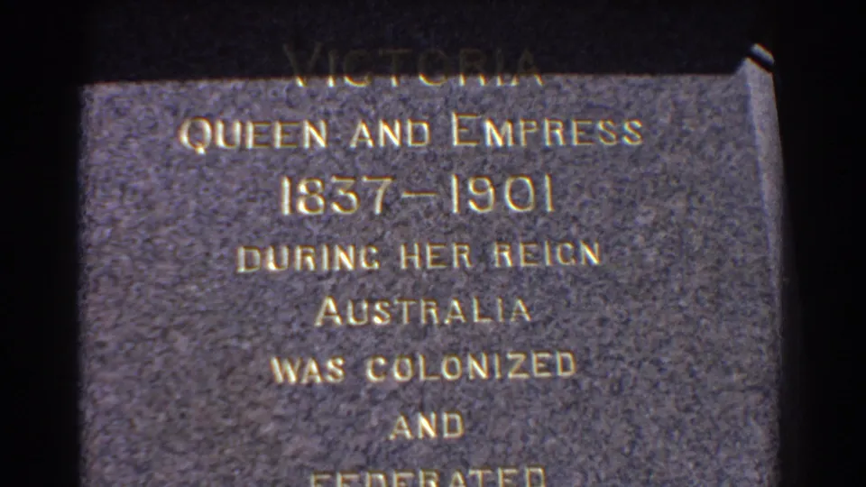 1967 Perth frame focused on the Queen Victoria memorial plaque, with gold lettering about her reign, Australia, colonization, and federation.