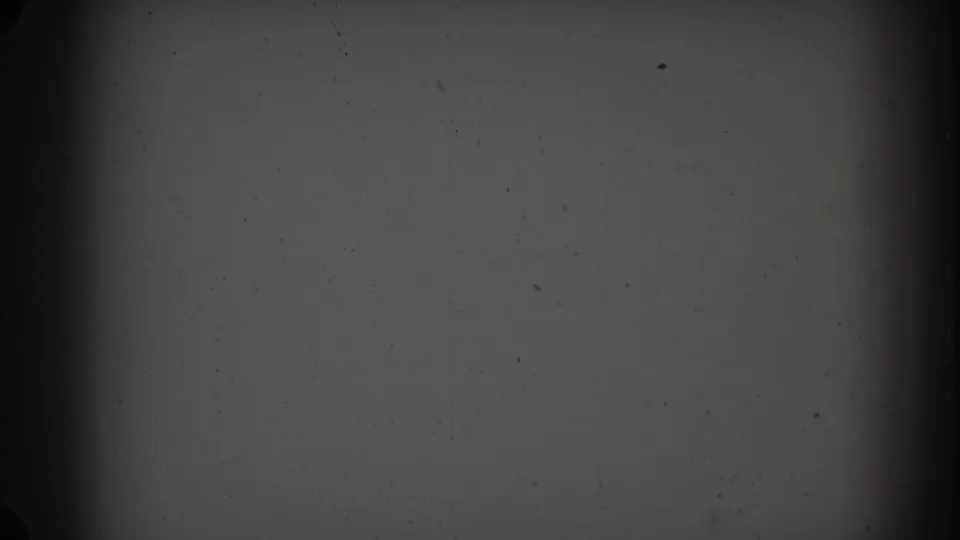 1967 Sydney 8mm frame with grey static texture, blackened side edges, film dust, and a central dark vertical line.