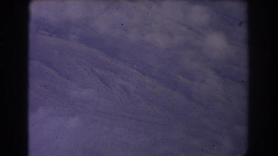 Purple-toned textured surface with diagonal folds or marks, visible grain, and dark 8mm border in the Sydney 1967 clip.
