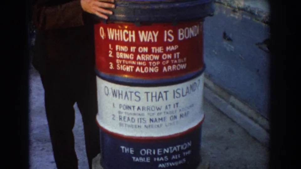 A lower-framed 1967 Sydney lookout shot shows the orientation table's red and white instruction bands beside the suited visitor.