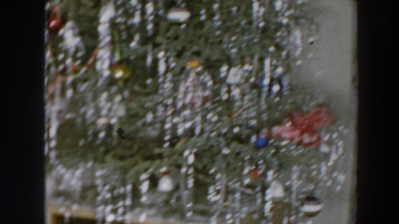 Close view of a decorated Christmas tree in the 1957 Wheeling, Ohio home-movie clip.