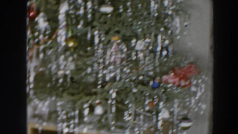 Close view of a decorated Christmas tree in the 1957 Wheeling, Ohio home-movie clip.