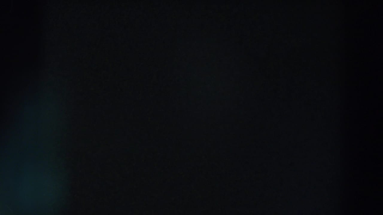 Dim 8mm night frame from Wheeling, Ohio, with soft blue-green flare against an otherwise dark field.