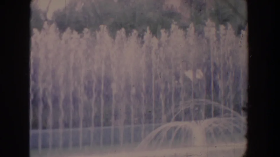 The 1958 Florida clip ends on fountain jets and arcing spray, with trees and plants beyond the pool.