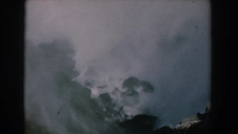 1958 8mm home-movie frame showing heavy mist and a partly obscured waterfall view at Niagara Falls.