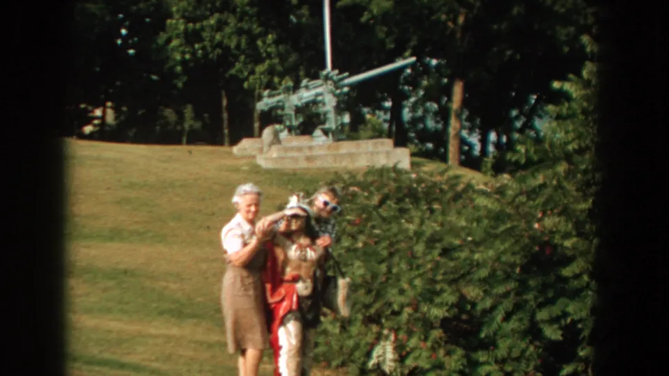 At the end of the short 8mm shot, the women and child shift position near the shrubs, with the Florida park artillery display still visible.