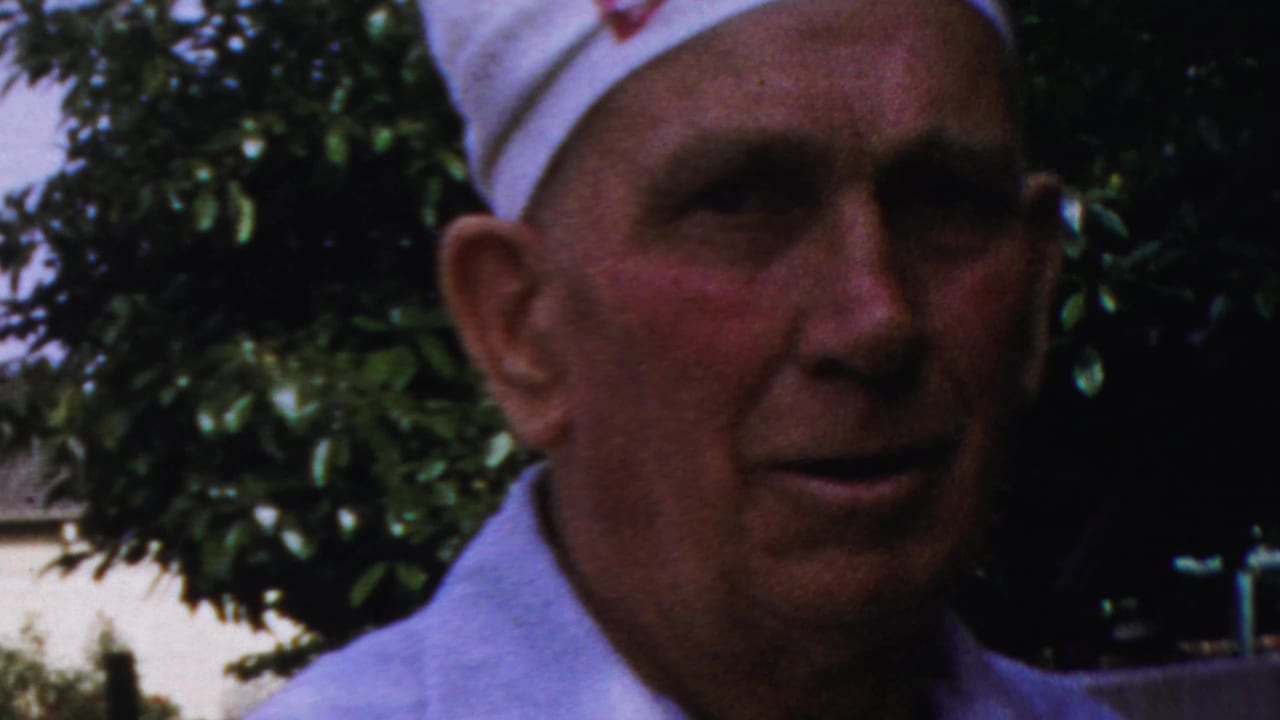 1959 Paramus frame with the older man now facing the camera, his expression still mostly neutral.