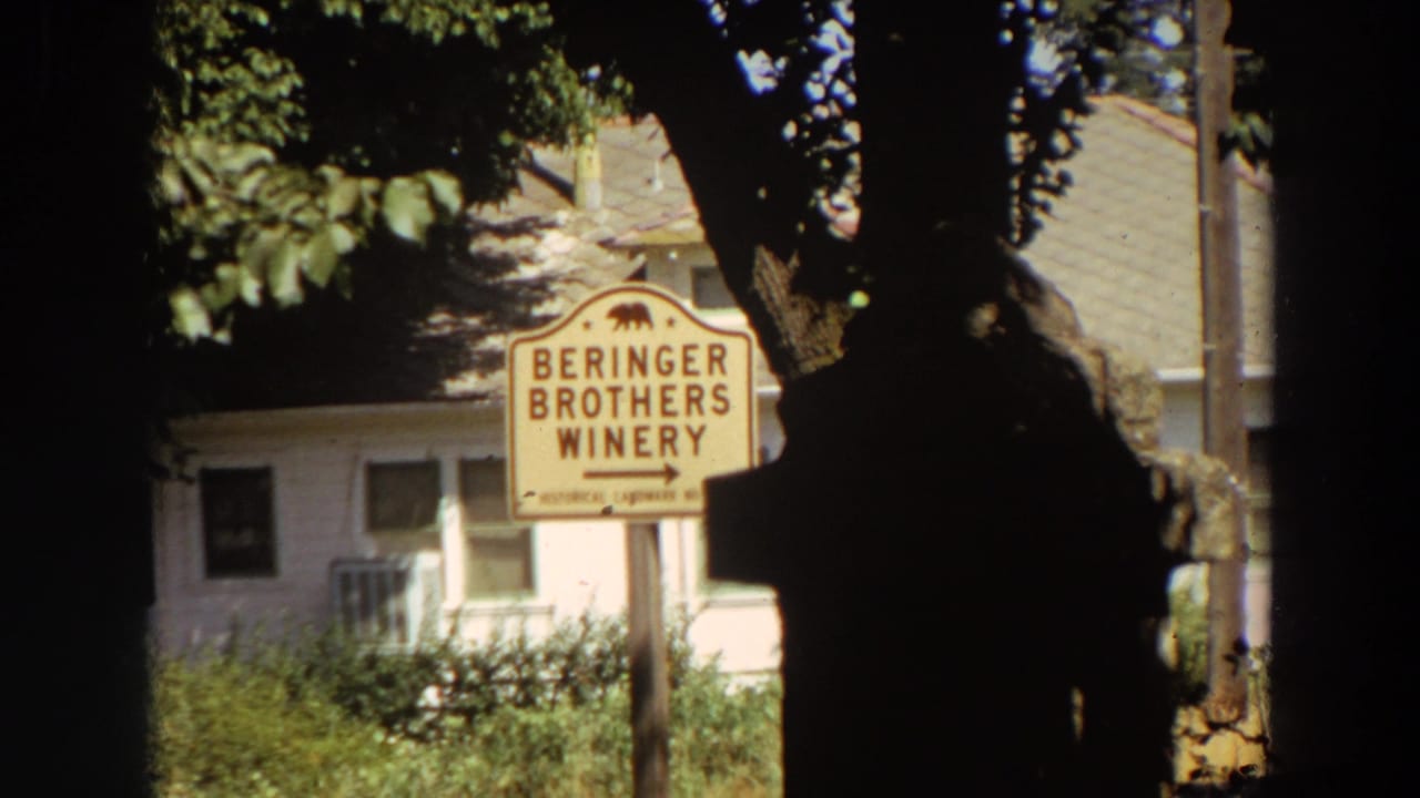Beringer Brothers Winery sign in front of a pale building and trees.