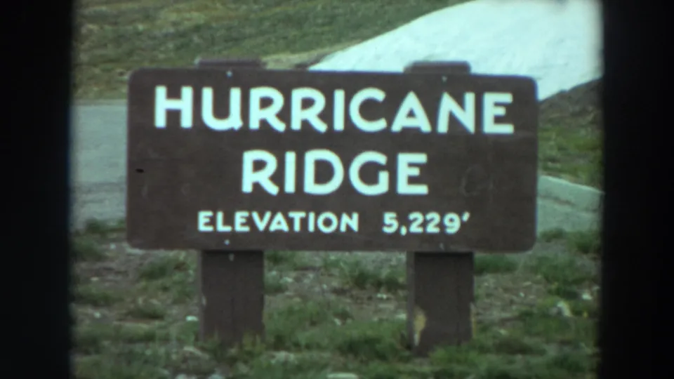 Roadside Hurricane Ridge sign with elevation 5,229 feet, filmed in a 1964 Washington 8mm home movie.