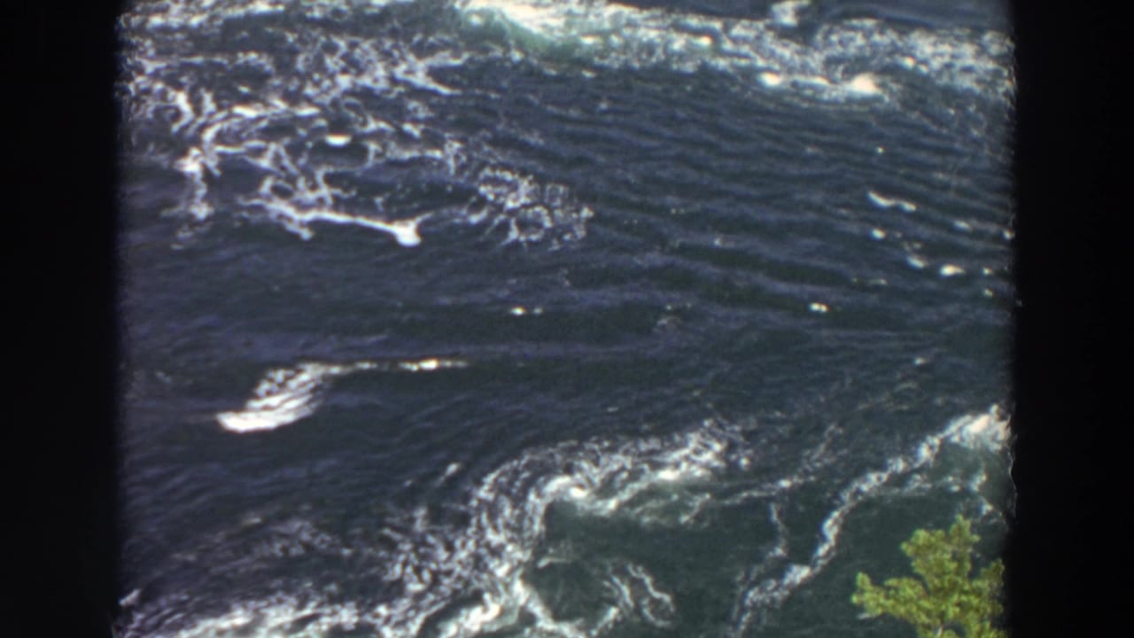 Fast dark river water with white foam and black 8mm frame borders.