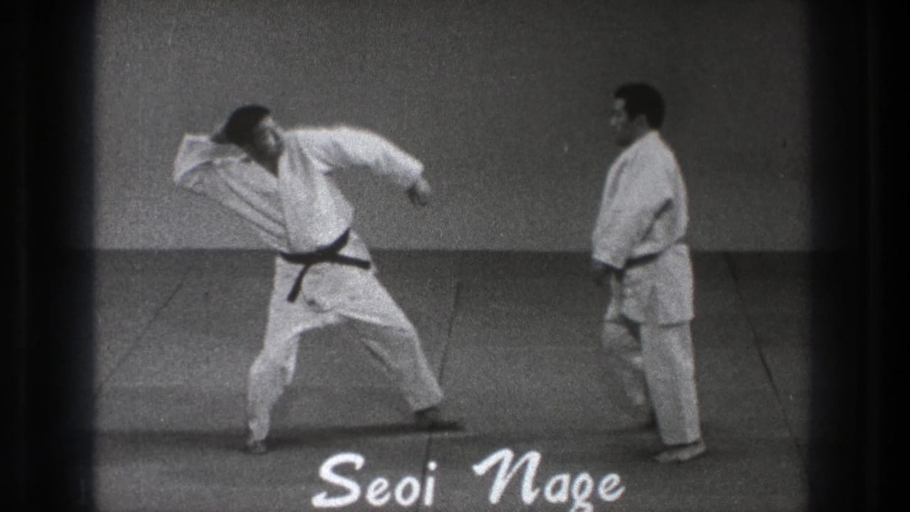 Two men in white gi on mats, one beginning a throwing motion beside a Seoi Nage title.