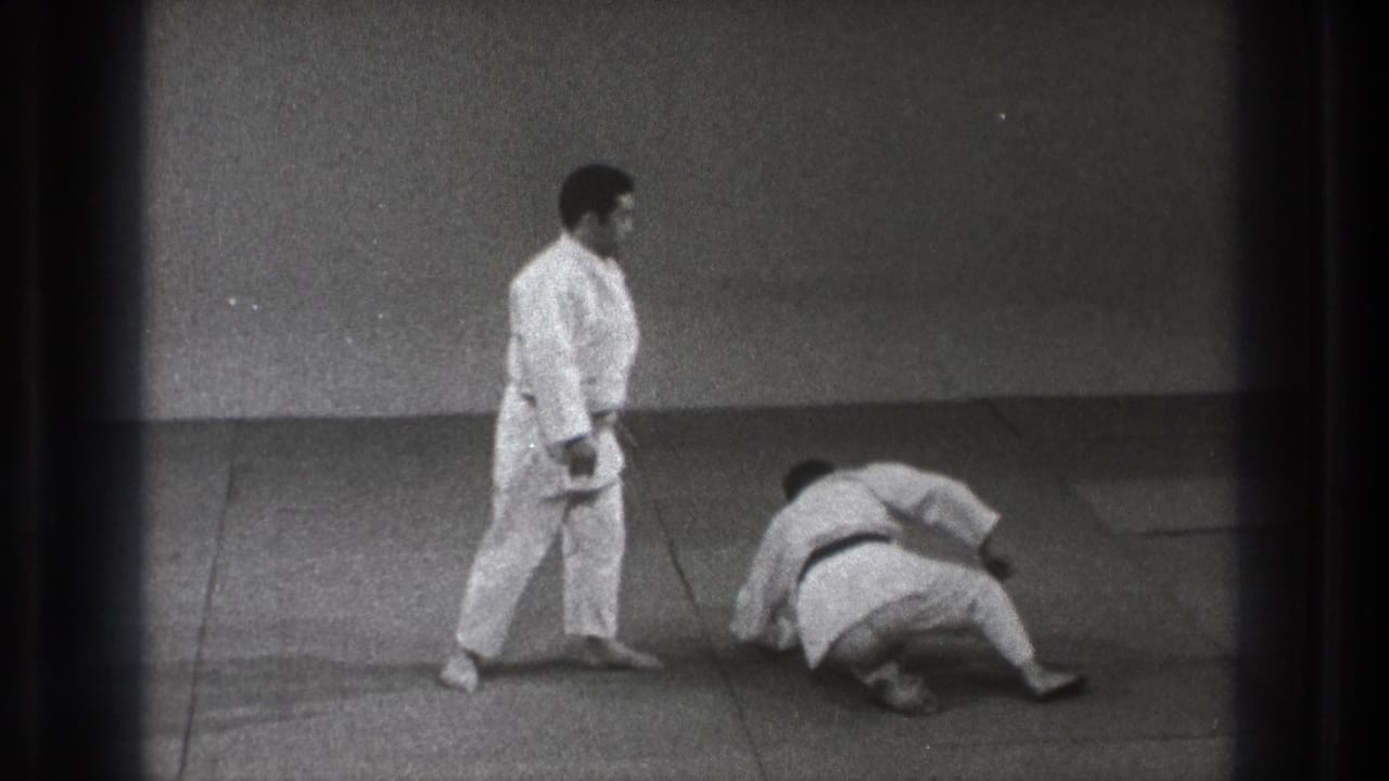 The final frame shows the Tokyo judo demonstration after the movement, with one man upright and the other turned on his side on the training mat.