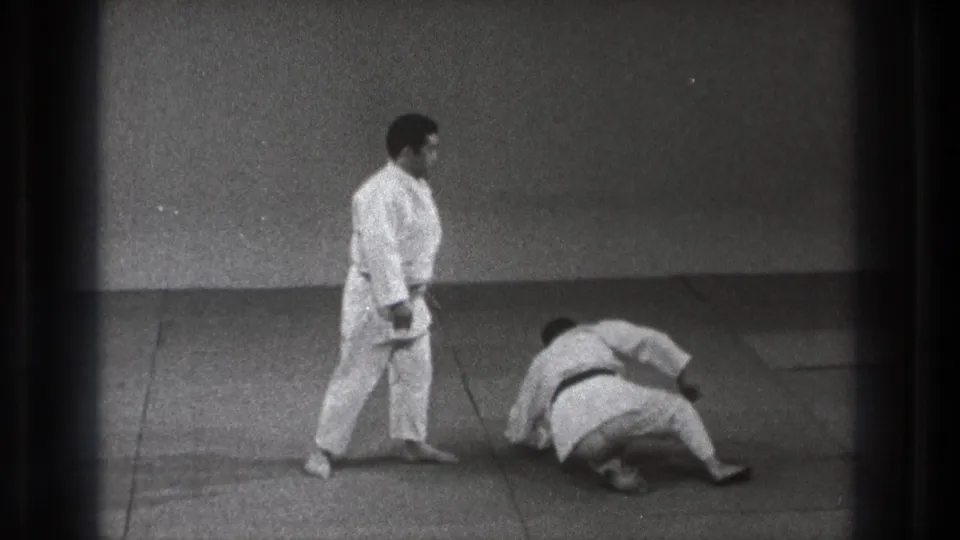 The final frame shows the Tokyo judo demonstration after the movement, with one man upright and the other turned on his side on the training mat.