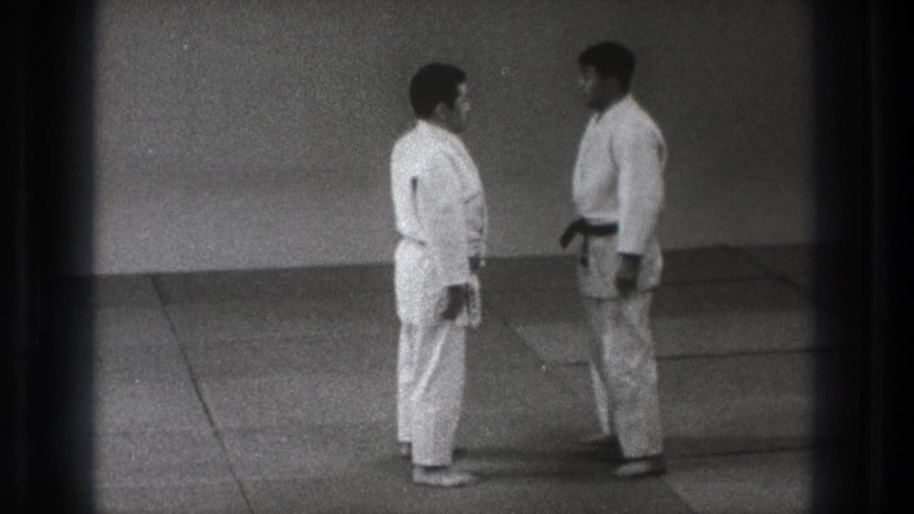 The 1971 Tokyo judo footage shows two practitioners facing each other in a quiet dojo setting.