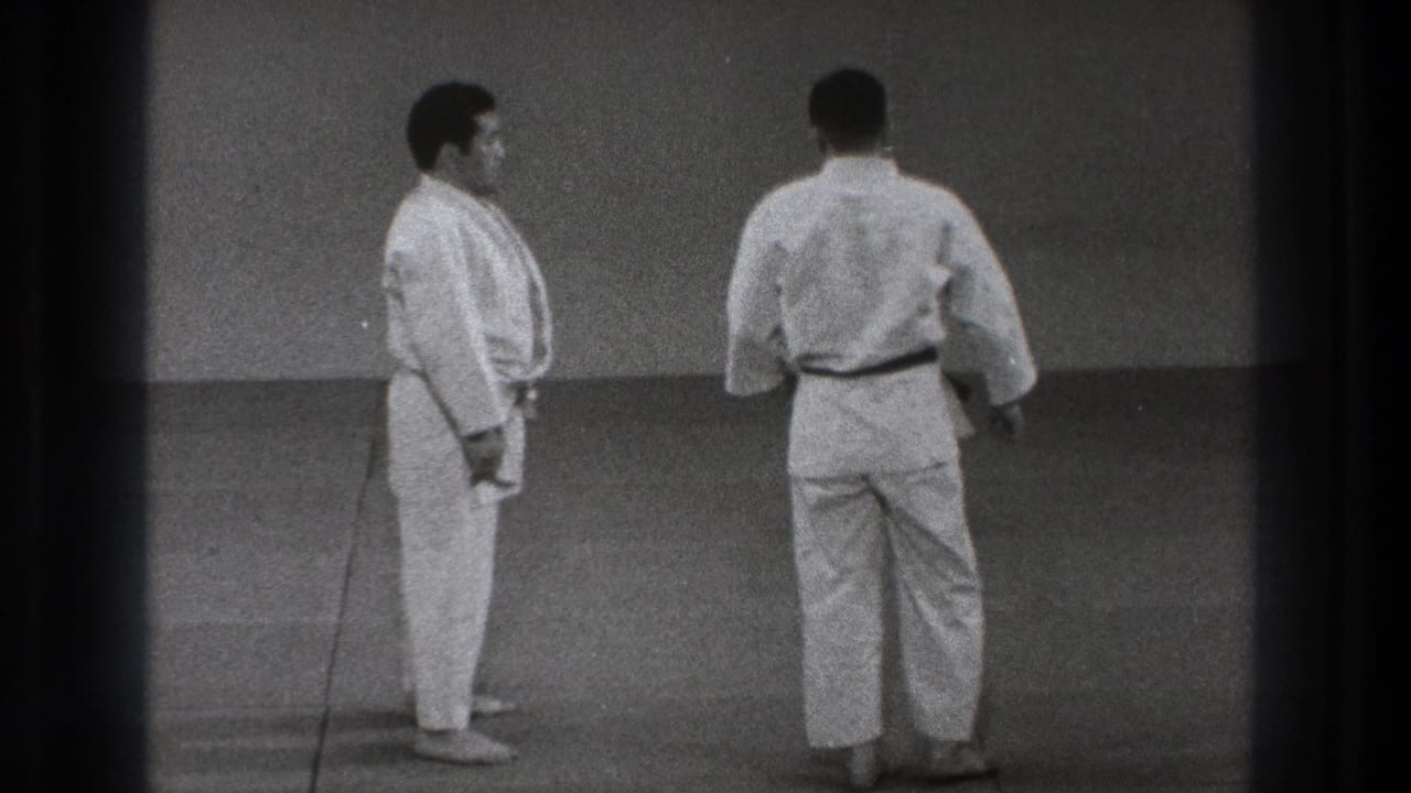 At the end of the short 1971 Tokyo sequence, the two men face each other on the mat after resetting the exercise.
