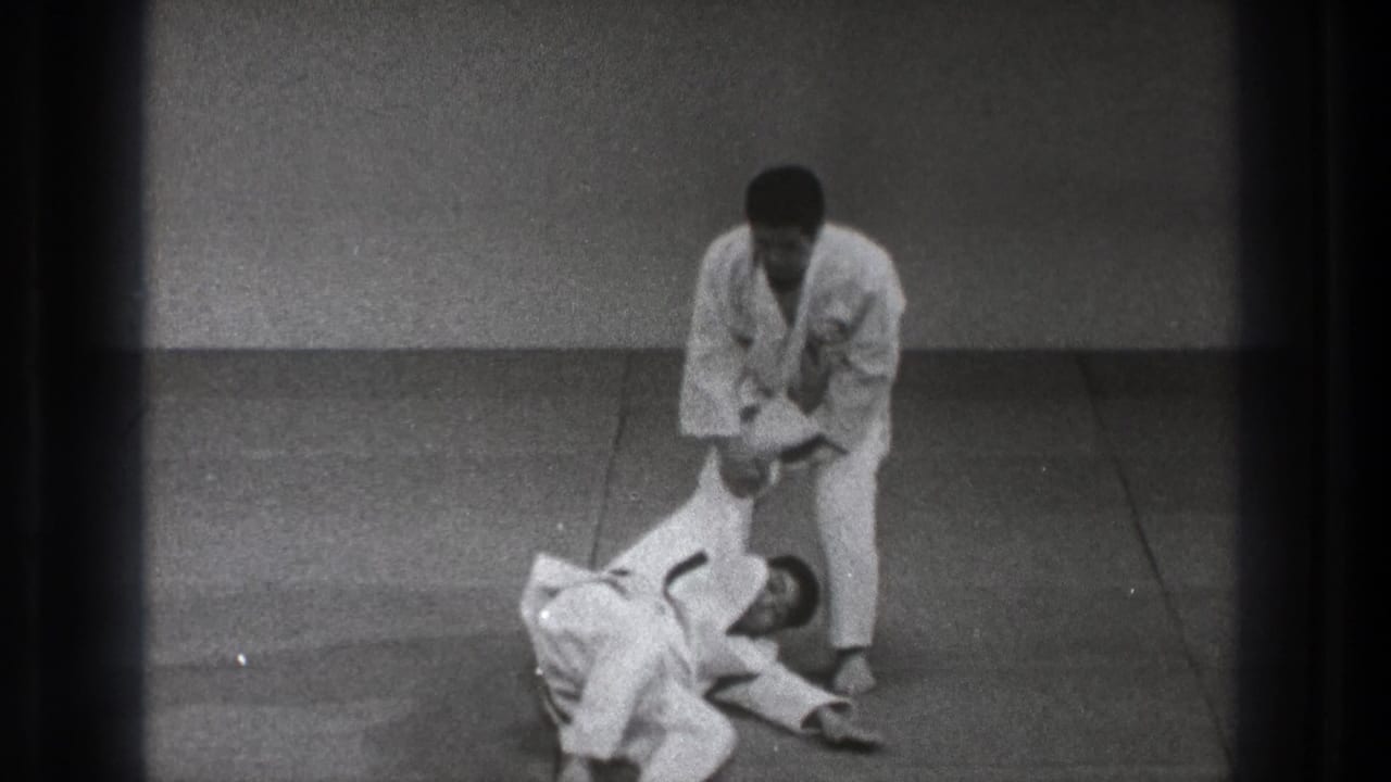 The final 1971 Tokyo frame shows the standing practitioner holding his partner's arm as the partner lies on the dojo mat.
