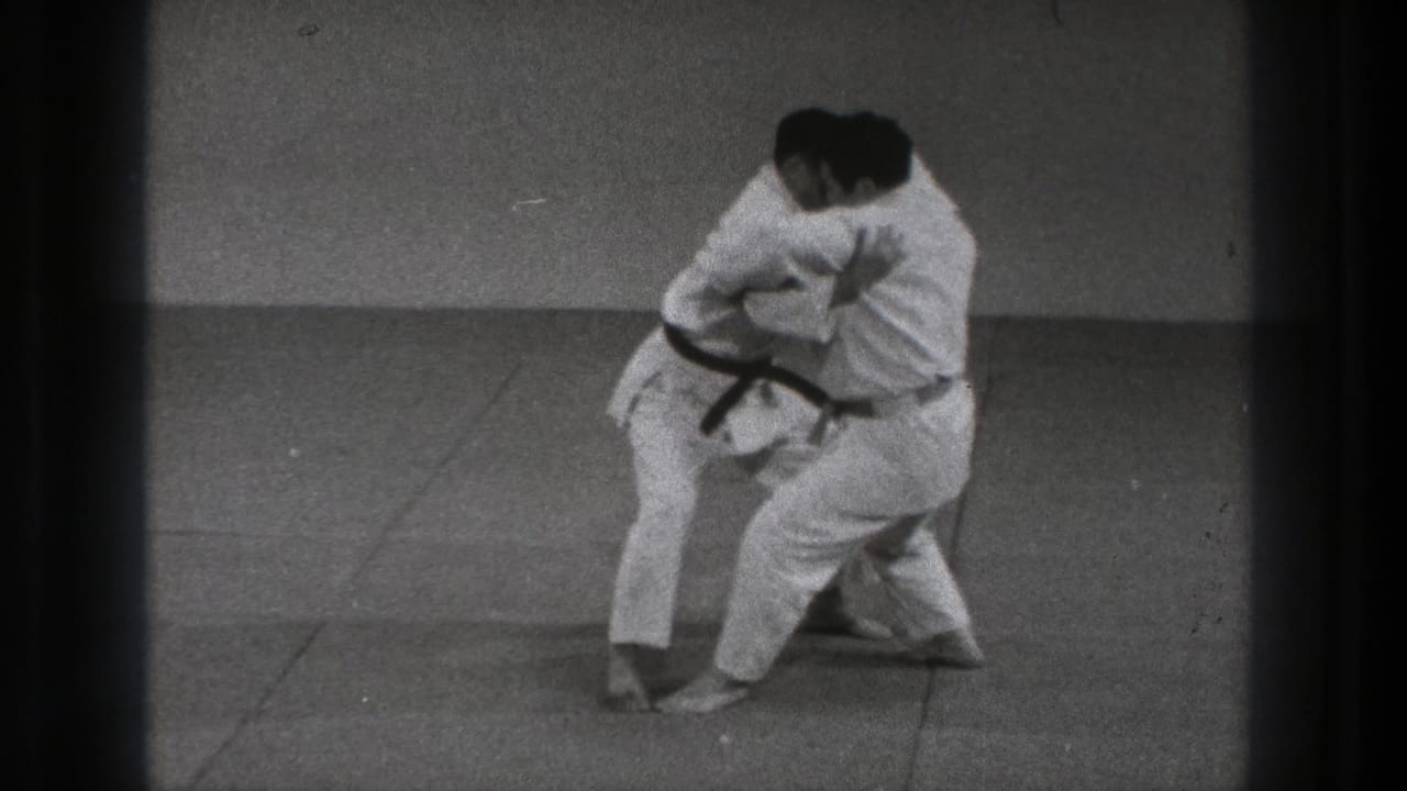 The karate pair continues the 1971 Tokyo demonstration, with one practitioner turning into a takedown setup.