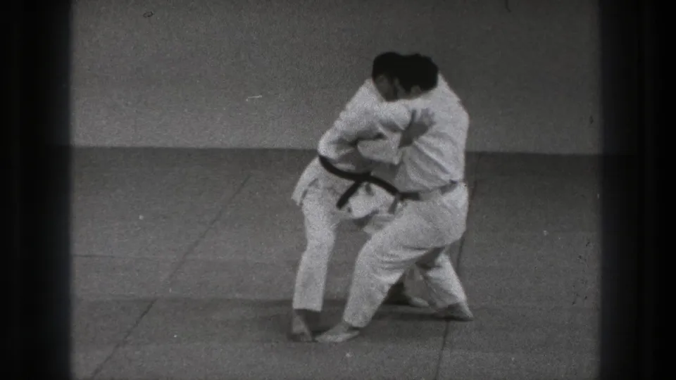 The karate pair continues the 1971 Tokyo demonstration, with one practitioner turning into a takedown setup.