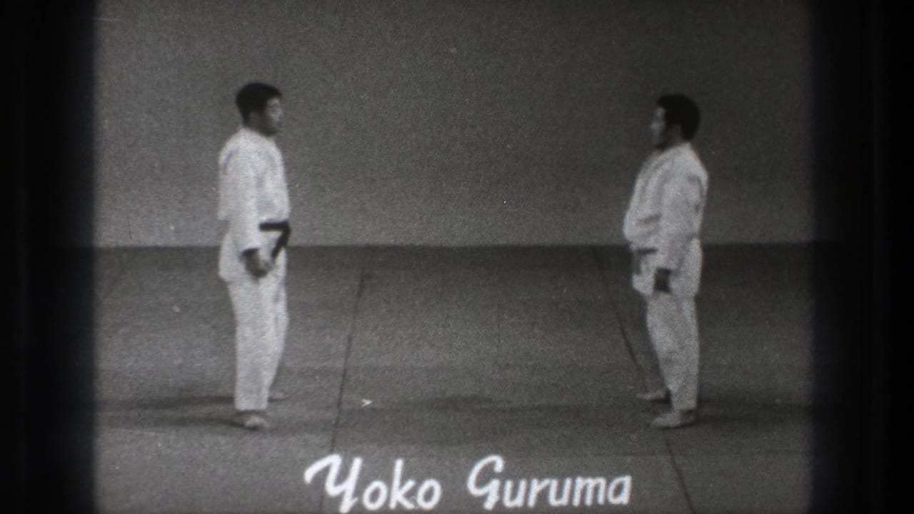 1971 Tokyo martial arts demonstration frame with two practitioners and the on-screen title Yoko Guruma.