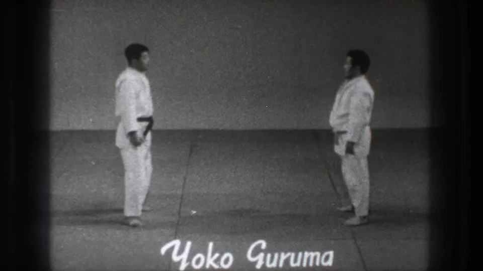 1971 Tokyo martial arts demonstration frame with two practitioners and the on-screen title Yoko Guruma.