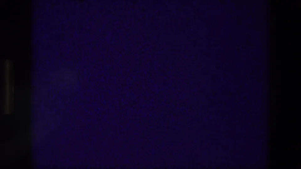 The sequence ends on a dark blue static-like 8mm frame, suggesting an in-camera or reel transition rather than visible subject matter.