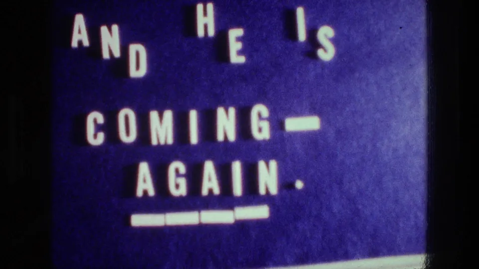 Late frame of the 1976 Athens home-movie title card, with the blue background and white religious text still visible.