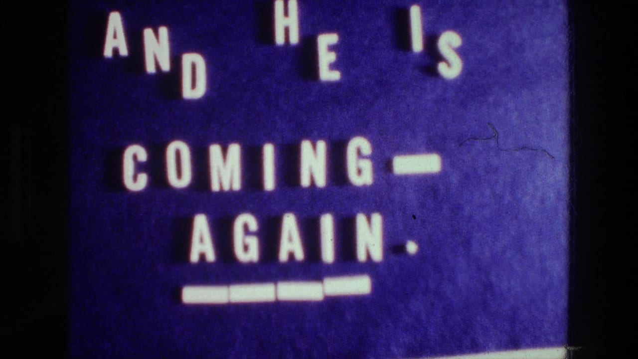 1976 Athens home-movie title card with staggered white letters on a purple board reading AND HE IS COMING AGAIN.