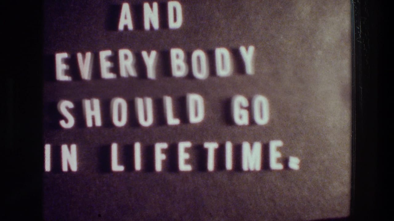 Cropped letterboard text reading “AND EVERYBODY SHOULD GO IN LIFETIME.” above a blue field.