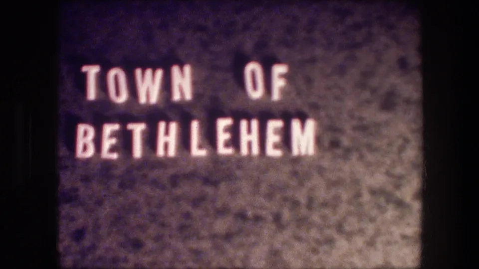 Static Bethlehem title card from the supplied 1976 8mm footage, with white lettering and visible film grain.