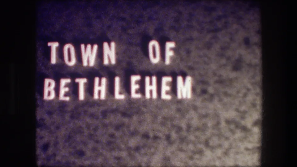 Final sampled frame of the 1976 Bethlehem title card, with white block text and aged 8mm film texture.