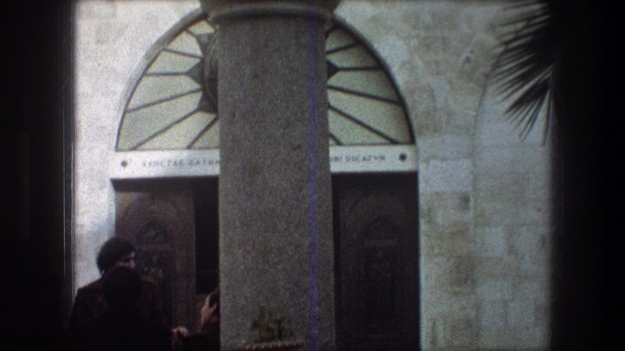 Robed men stand near a stone doorway beneath an arched transom.