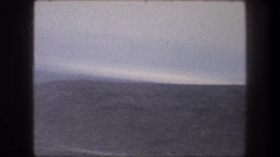 1976 8mm travel view near Bethlehem, Israel, showing muted hills through a moving car window.