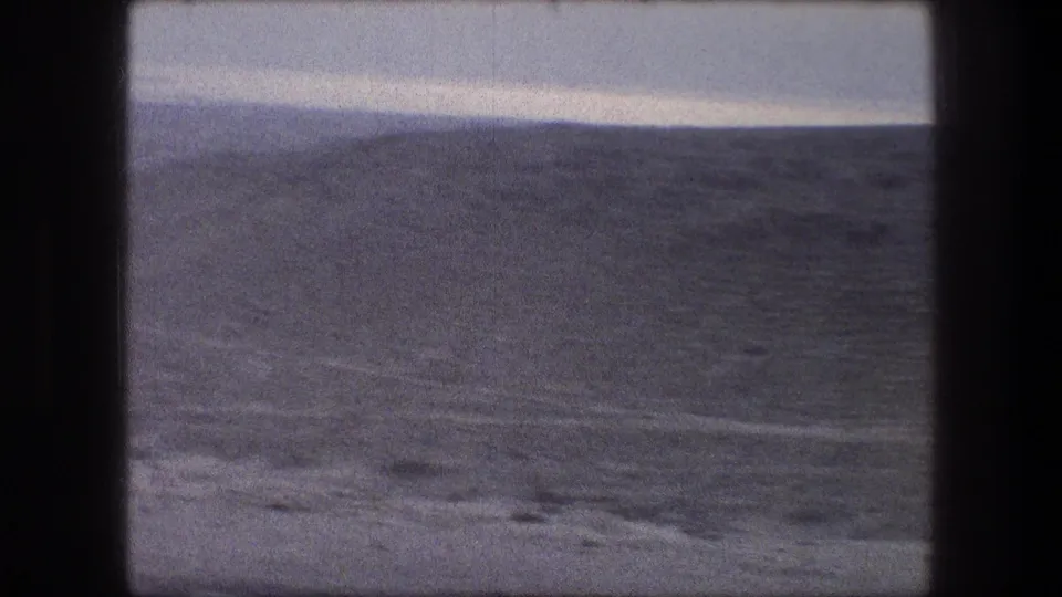 1976 8mm view of rolling terrain near Bethlehem, Israel, filmed from a moving vehicle.